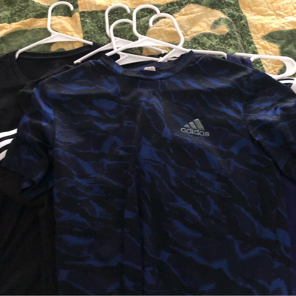 Multi-colored adidas shirt. Black and blue material.color.